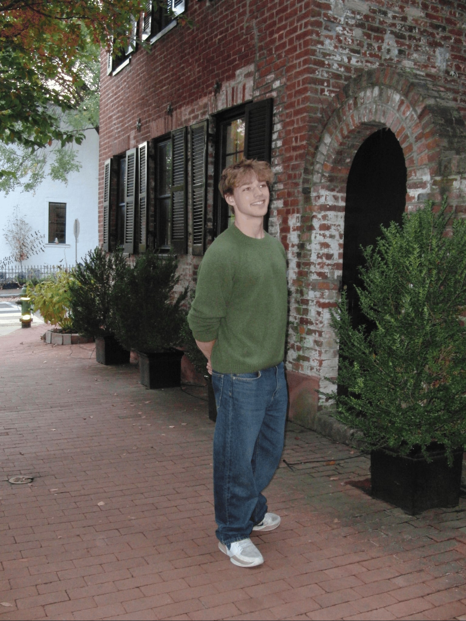 Jake Frischmann standing on a brick sidewalk